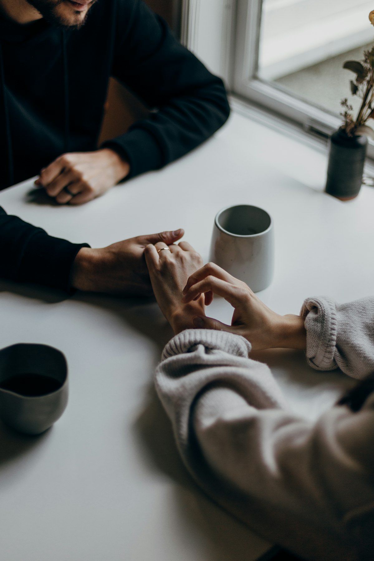 A couple talking over coffee