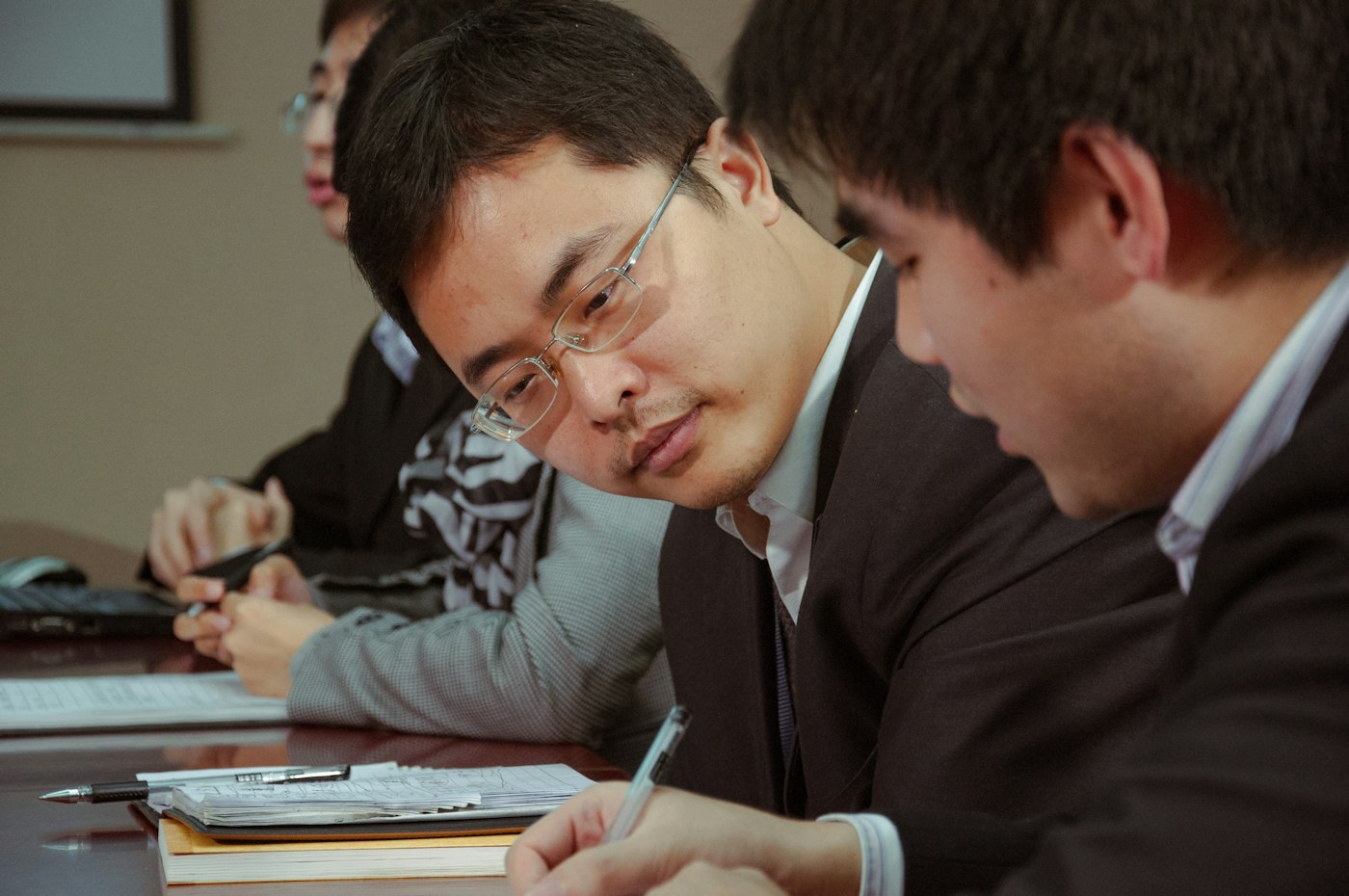 Two professionals reviewing documents together